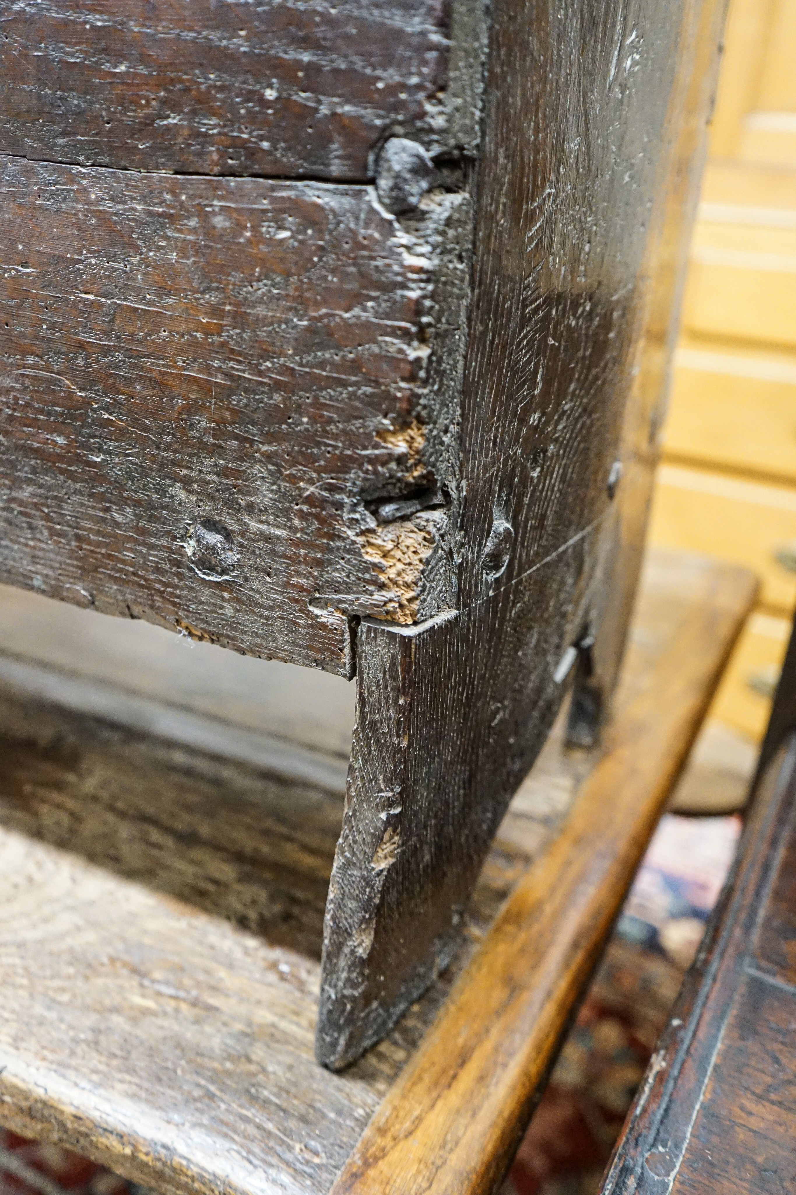 A 17th century oak and elm six plank coffer, width 104cm, depth 36cm, height 54cm